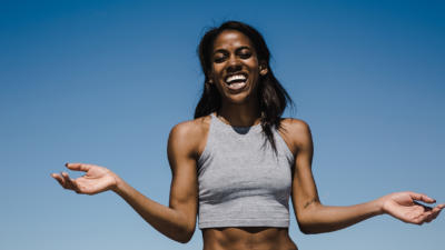 Woman laughing with hands out